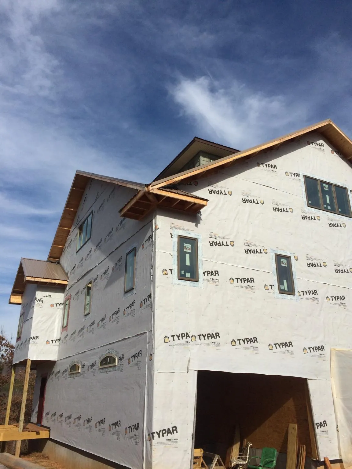 Stick built house wrapped in Typar with new roof framing and dormers in Tomah